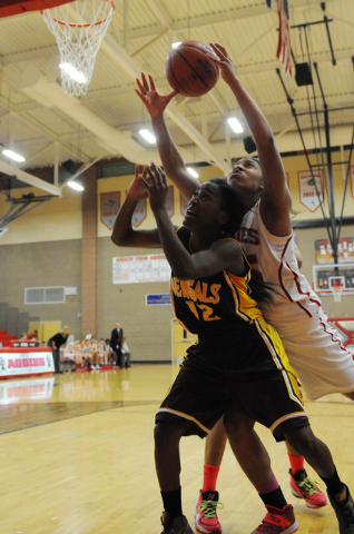 Arbor View’s Dana Lewis (25) reaches for a rebound against Bonanza’s defender Ac ...