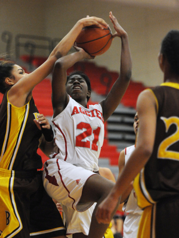 Arbor View’s Jocelyn Jordan (21) has a shot blocked by Bonanza’s Sianna Nelson ( ...