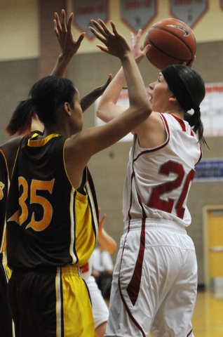 Arbor View’s Katie Wolfram (20) takes a shot over Bonanza’s Alexis Harris (35) o ...