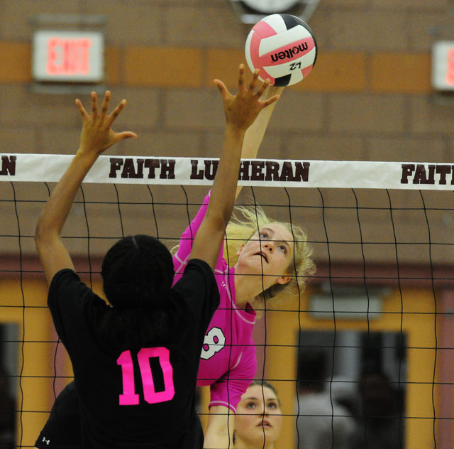 Faith Lutheran’s Bryanna Neagle (8) kills the ball against Palo Verde during their pre ...