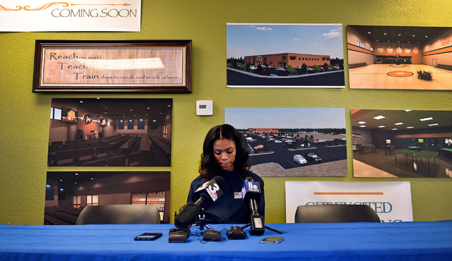 Bishop Gorman high jumper Vashti Cunningham reviews her notes at a news conference at Remnan ...