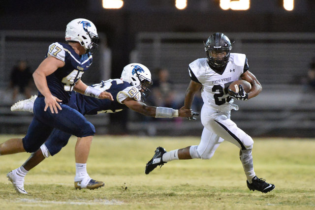 Palo Verde running back Terrill Jimerson (25) breaks a tackle from Foothill cornerback Titus ...