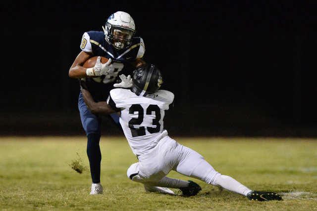 Foothill receiver Jordan Blakely (18) breaks a tackle during the Foothill High School Palo V ...