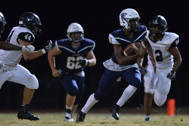 Foothill quarterback Jordan Wilson (11) carries the ball during the Foothill High School Pal ...