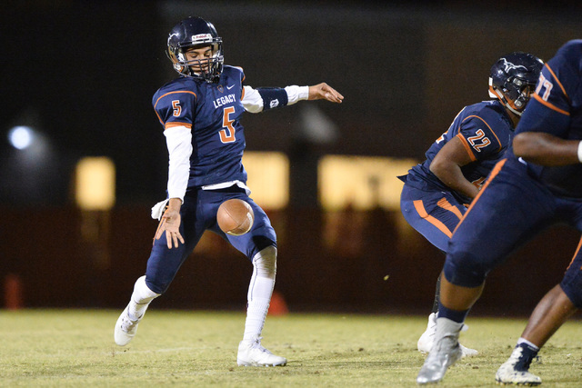 Legacy quarterback Roberto Valenzuela (5) kicks the ball during the Legacy High School Palo ...