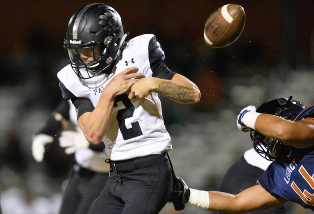 Legacy linebacker Jalen Alacati (44) strips the ball away from Palo Verde quarterback Jonath ...