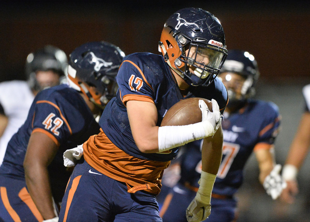 Legacy defensive end Skye Parker (12) returns a fumble for a touchdown during the Legacy Hig ...