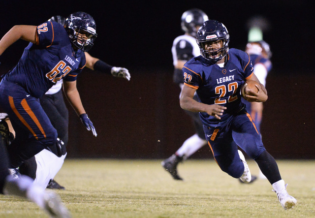 Legacy running back Sam Turner (22) runs the football during the Legacy High School Palo Ver ...