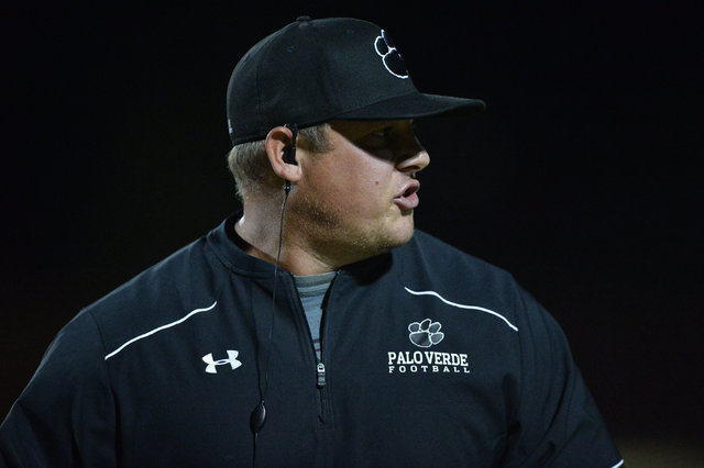 Palo Verde head coach Joe Aznarez talks to an assistant coach during the Legacy High School ...