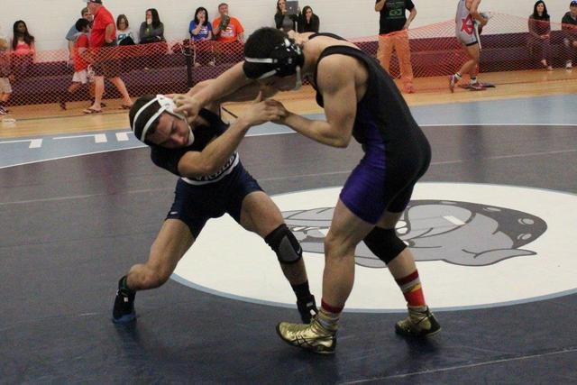 Spring Valley’s Eduardo Penha fends off a head slap from Durango’s Anhony Catalf ...