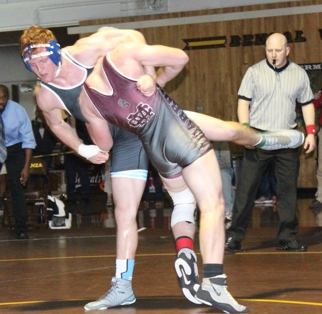 Centennial’s David Porter (left) attempts to take down Cimarron-Memorial’s Davin ...