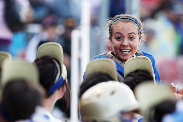 Reed’s Rheanna Smith leads cheers in the dugout during their game against Palo Verde ...