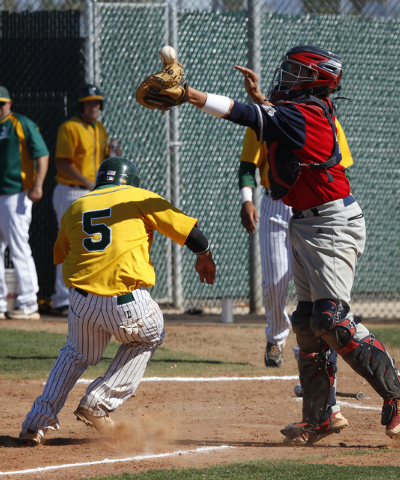 Rancho’s David Modler, left, sneaks past Coronado catcher Nicco Festa on Tuesday. The ...