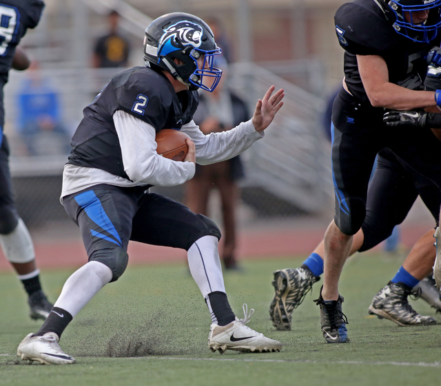 Pahranagat Valley’s Quarterback Tabor Maxwell (2), runs with the ball during the class ...