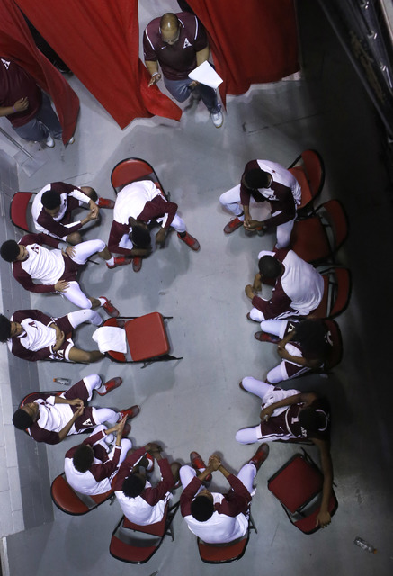 Agassi Prep head coach Trevor Diggs, right, walks into the room during halftime of a Class 2 ...