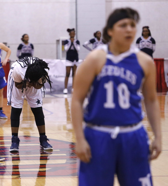 Agassi Prep’s Sharmayne Finley (30) reacts after fouling Needle’s Brenna Chavez ...