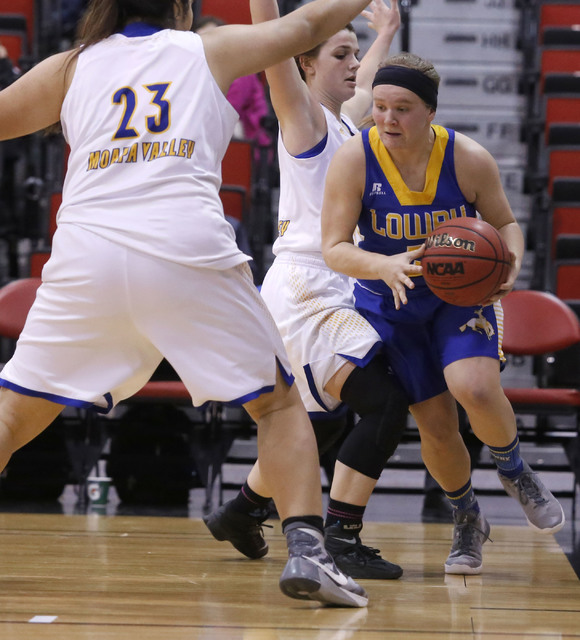 Lowry’s Tiana Herrera (5) drives the ball pass Moapa Valley’s Kaila Enosa (23) d ...