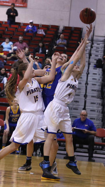 Lowry’s Broklyn Waller (22), Moapa Valley’s Shelbi Walker (15) and Moapa Valley& ...