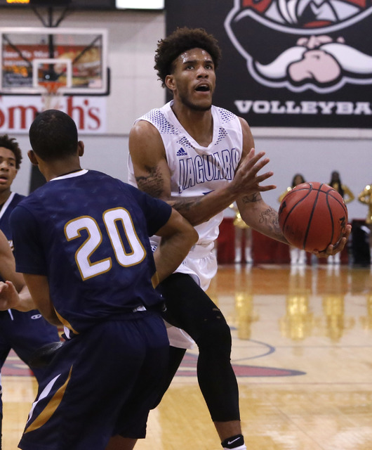 Desert Pines Trevon Abdullah-Booker (3) shoots over Cheyenne during the second half of a Cla ...