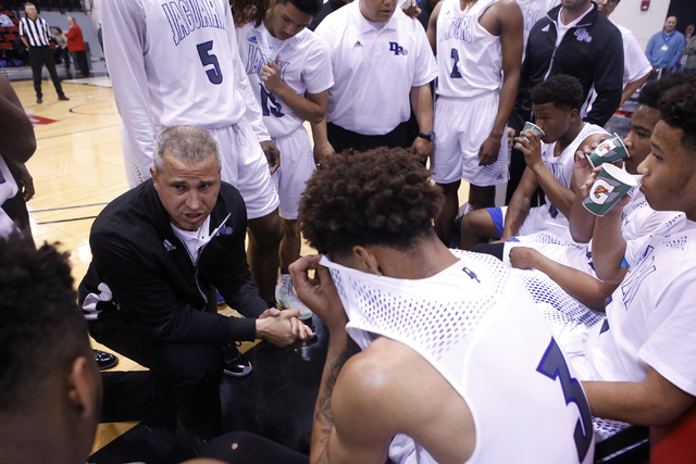 Desert Pine’s head coach Mike Uzan speaks to the players during the second half of a C ...