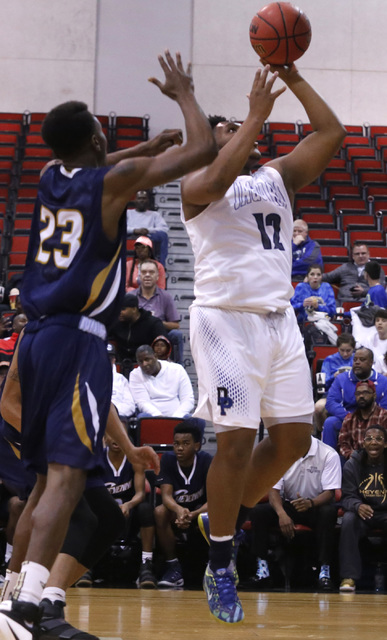 Cheyenne’s Jaiden Martin (12) over Desert Pine’s Donovan Word (23) during the fi ...