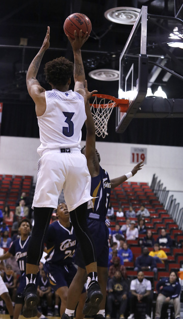 Desert Pines’ Trevon Abdullah-Booker (3) shoots during the first half of a Class 3A bo ...