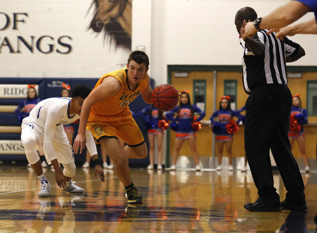 Clark’s James Bridges (15) drive the ball pass Bishop Gorman’s Jamal Bey (2) dur ...