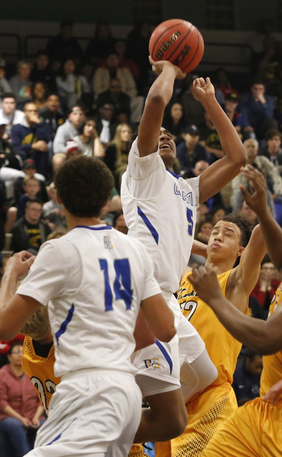 Bishop Gorman’s Chuck O’Bannon (5) shoots during the second half of a Class 4A S ...