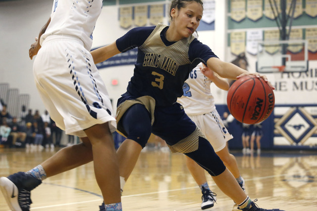 Spring Valley’s Essence Booker (3) recovers a loose ball during the first half of a Cl ...