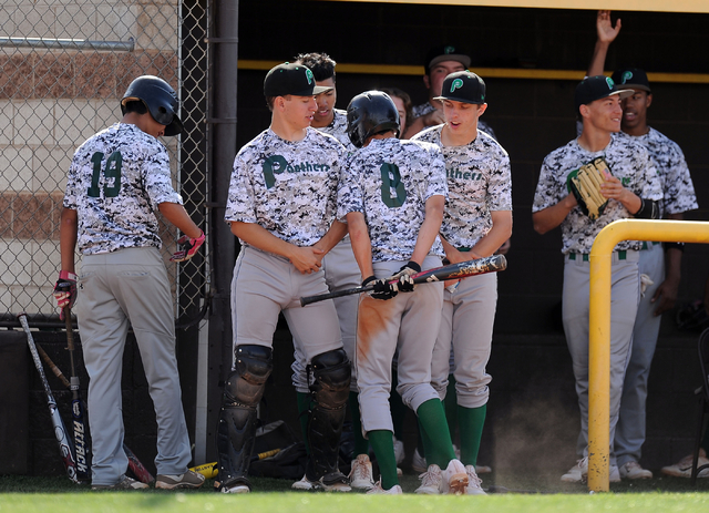 Palo Verde outfielder Cobi Fiechtner (8) shoulder bumps teammates in celebration after scori ...