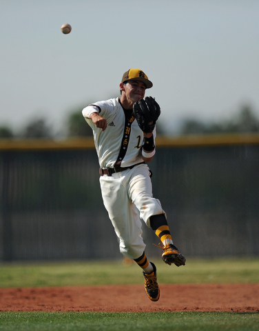 Bonanza shortstop Luis Lares throws out a Palo Verde base runner at first base in the fourth ...