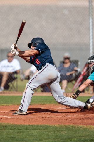 Liberty High School senior Preston Pavlica (11) swings at the ball during a baseball game at ...