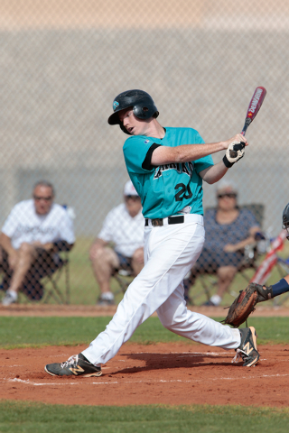 Silverado junior Michael Camburn (20) swings through a pitch during a baseball game against ...