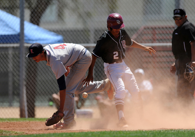 Desert Oasis base runner Chris Van Kuren scores the scores the team’s 10th and game en ...