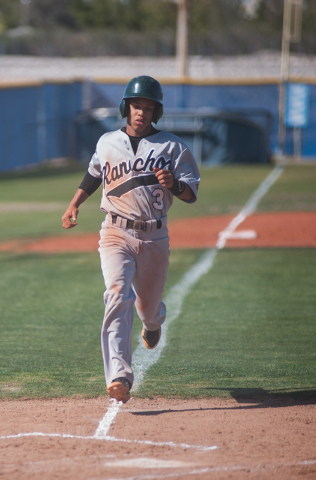 Rancho senior Bryce Harrell scores a run in the top of the first inning on Friday at Centenn ...