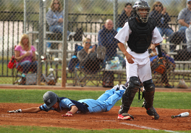 Foothill’s Daniel Ortiz slides in to home to score against Las Vegas High on Thursday. ...