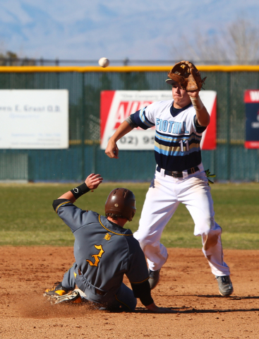 Bonanza’s Eric Schultz (3) slides safely into second base as Foothill’s Shay Lan ...