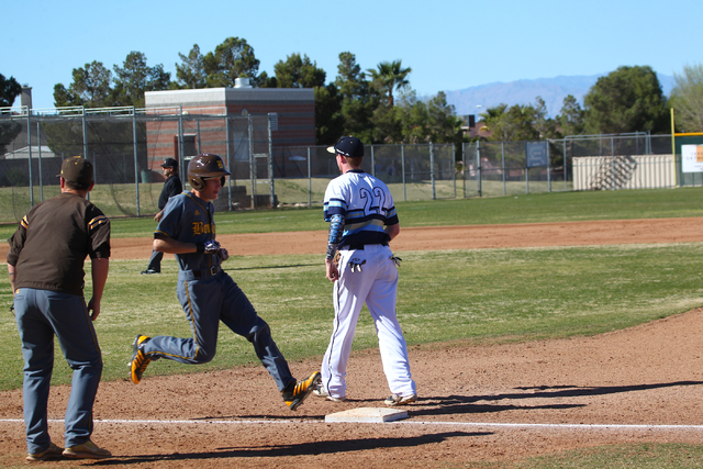 Bonanza’s Levi Klump (16) makes it safely to first base as Foothill’s Spencer Th ...