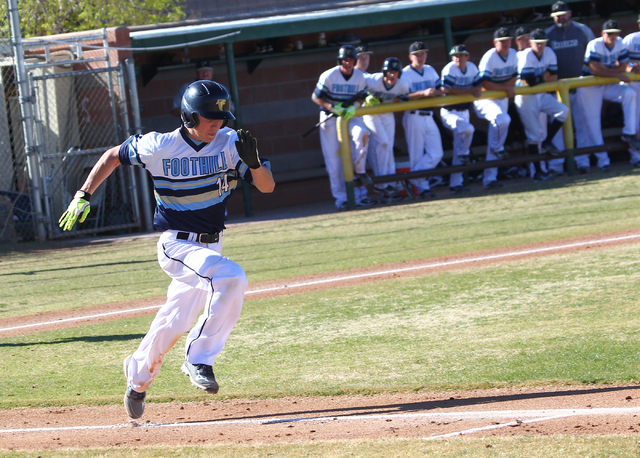 Foothill’s Ricky Kinney (14) runs to first base against Bonanza during a baseball game ...