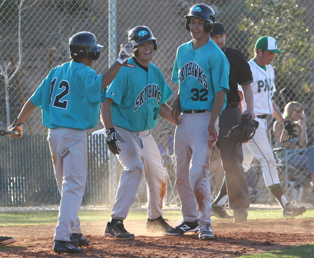 Silverado’s Alex Grafiada (12), Dillon Johnson (21) and Nick Kawano (32) celebrate Vin ...