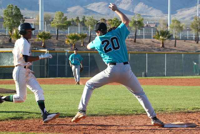 Silverado’s Michael Camburn (20) catches the ball before tagging out Palo Verde’ ...