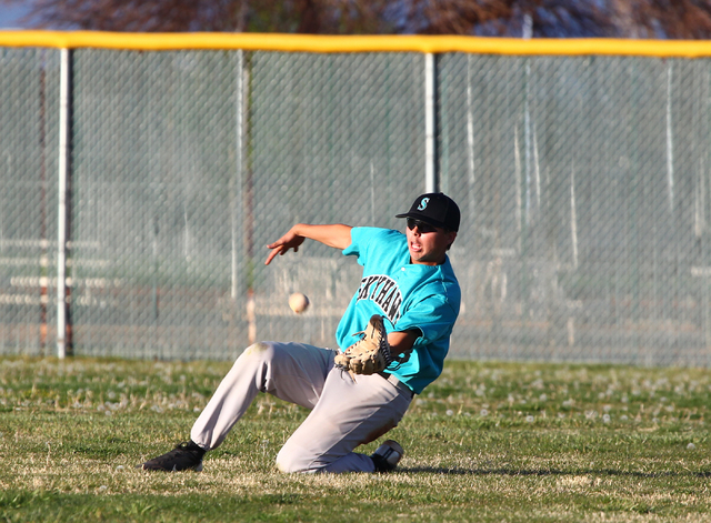 Silverado outfielder Aidan Adams (8) slides to catch a fly ball hit by Palo Verde’s Ke ...