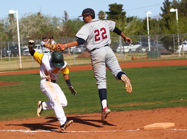 Rancho’s Bryce Harrell (3) ducks under the tag of Liberty’s Omar Ortiz (22) duri ...