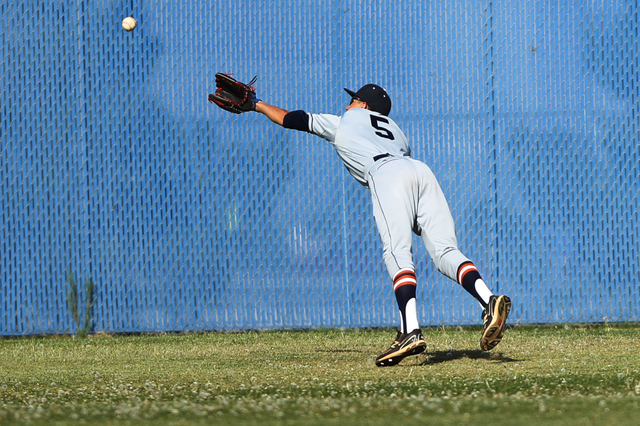 Legacy’s Anthony Lomeli (5) is short of a catch in the outfield in their baseball game ...