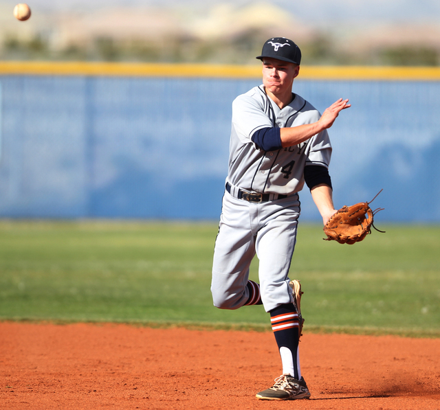 Legacy’s Alex Tadd (4) throws to first base for an out in their baseball game against ...