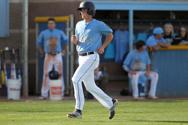 Centennial’s Anthony Saccente (17) runs home for a run in their baseball game against ...