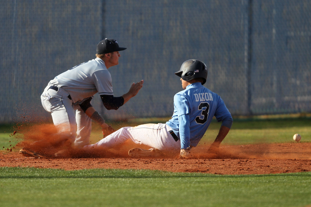 Centennial’s Zach Dixon (3) slides safe to third base for a triple in their baseball g ...