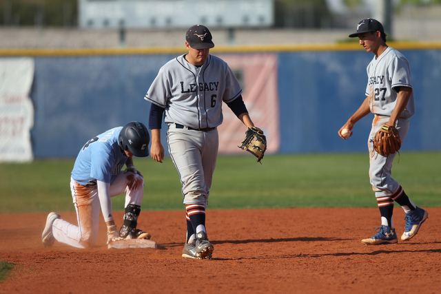 Centennial’s Jake Portaro (24) slides safe to second base in their baseball game again ...