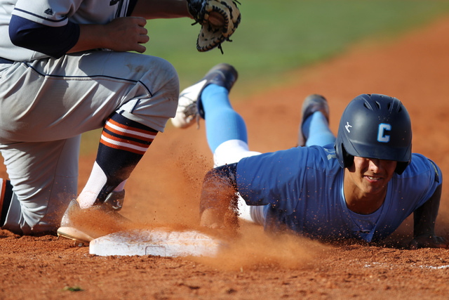 Centennial’s Tyler Hennis (8) is picked off at first base by Legacy’s Austin Mic ...