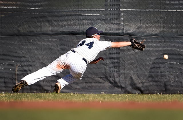 Spring Valley right fielder Nick Rupp dives for a fly ball hit by Coronado’s Jordan Da ...